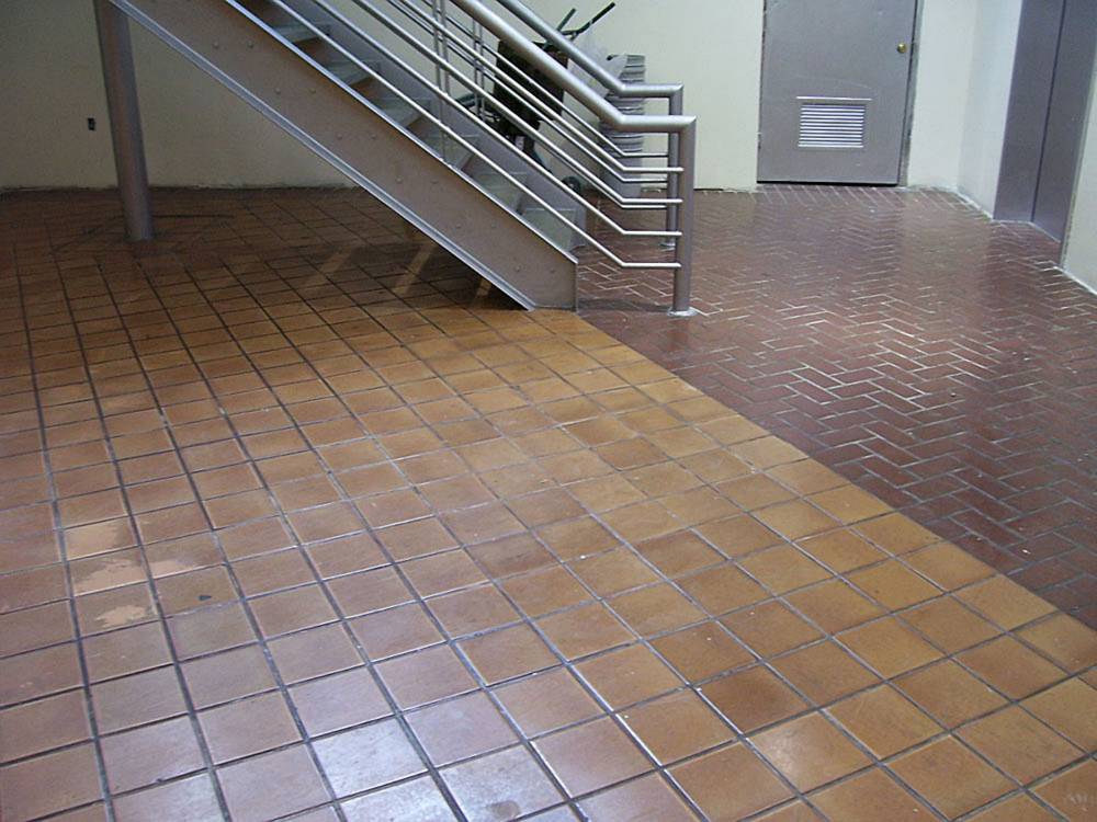 Existing tile and brick floor in need of updating.